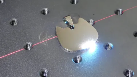 Process video demonstrating the creative freedom of a fiber laser engraving a custom pet ID tag with a hand-drawn illustration and unique typography. Showcasing the ability to engrave complex images and unlimited text that traditional pet store machines cannot achieve.
